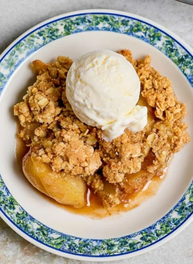 Delicious homemade apple crumble served in a cozy dish.