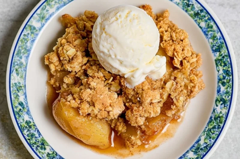 Delicious homemade apple crumble served in a cozy dish.
