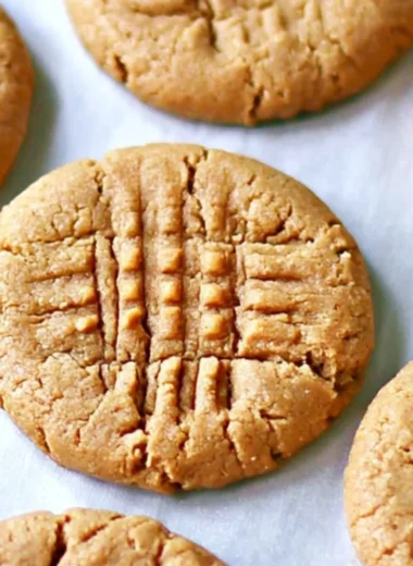 Cozy 3-ingredient peanut butter cookies on a baking tray.