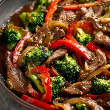 Cozy beef stir fry with colorful vegetables in a sizzling pan