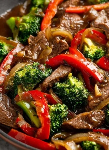 Cozy beef stir fry with colorful vegetables in a sizzling pan