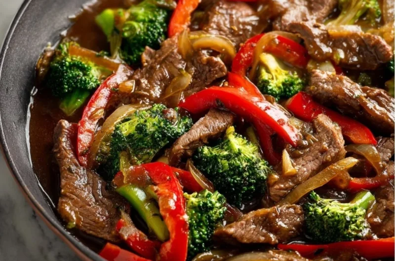 Cozy beef stir fry with colorful vegetables in a sizzling pan