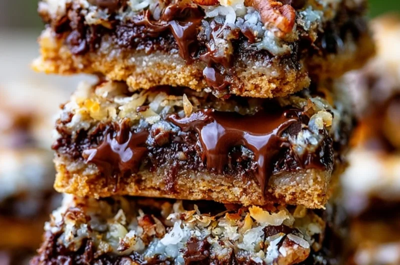 Delicious Hello Dolly magic cookie bars topped with chocolate and coconut.