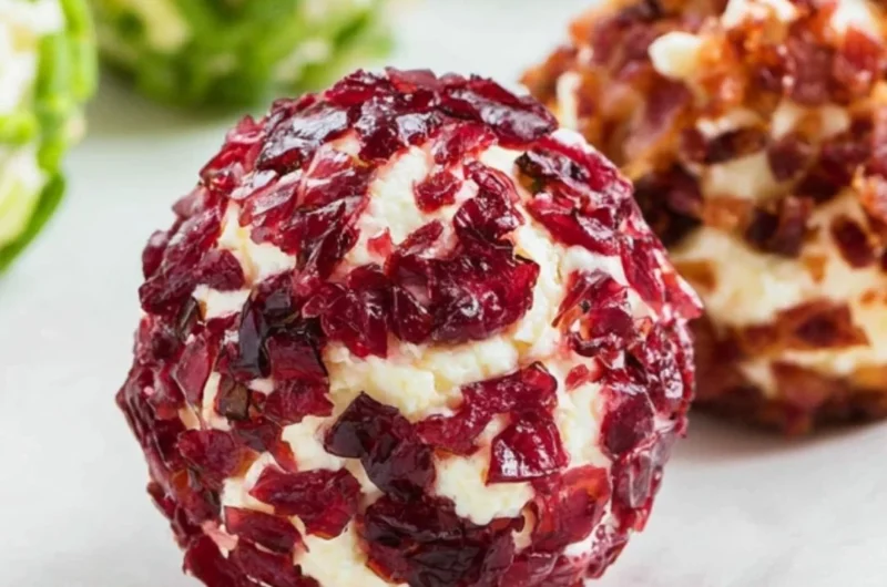 Cozy mini cheeseball bites served on a platter with toppings