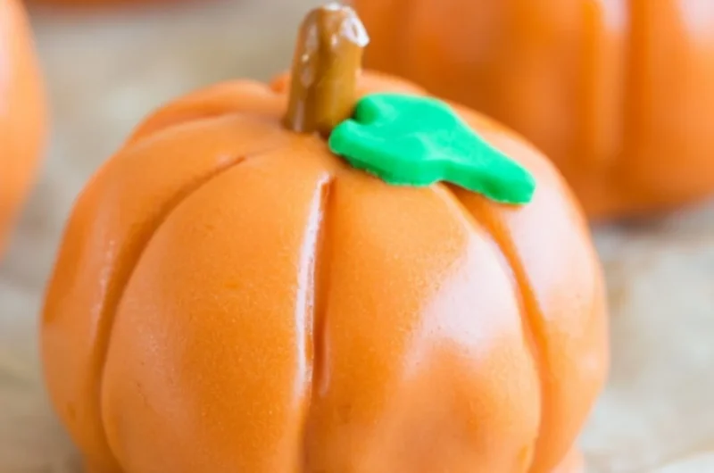 No-bake pumpkin-shaped Oreo balls decorated for fall treats