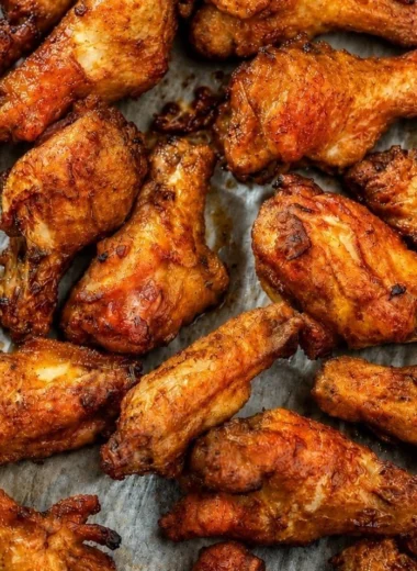 Cozy smoked chicken wings on a platter, flavorful and ready to enjoy.