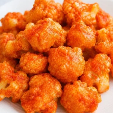 Cozy vegan cauliflower nuggets served with dipping sauce on a plate