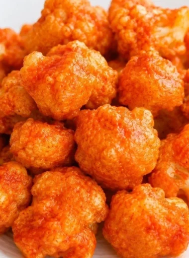 Cozy vegan cauliflower nuggets served with dipping sauce on a plate