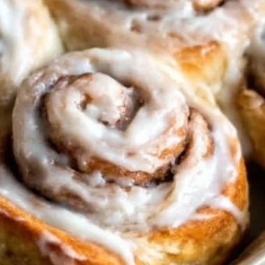 Freshly baked easy one hour cinnamon rolls topped with icing.