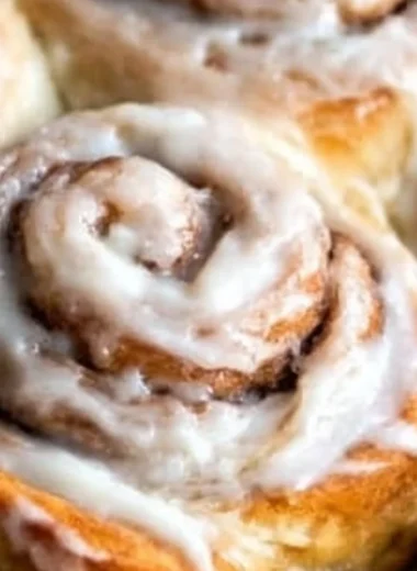 Freshly baked easy one hour cinnamon rolls topped with icing.
