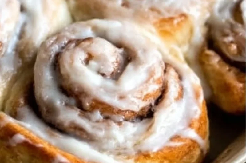 Freshly baked easy one hour cinnamon rolls topped with icing.