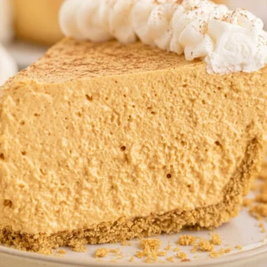 Delicious fluffy marshmallow pumpkin pie served on a plate