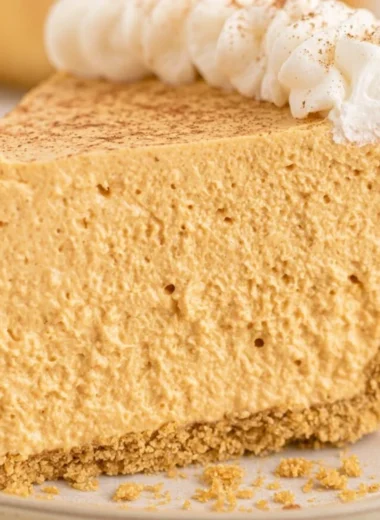 Delicious fluffy marshmallow pumpkin pie served on a plate