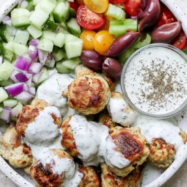 Delicious Greek chicken meatballs served with tzatziki sauce