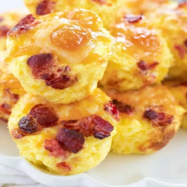 Make ahead bacon and cheese egg bites served in a meal prep container.