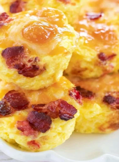 Make ahead bacon and cheese egg bites served in a meal prep container.