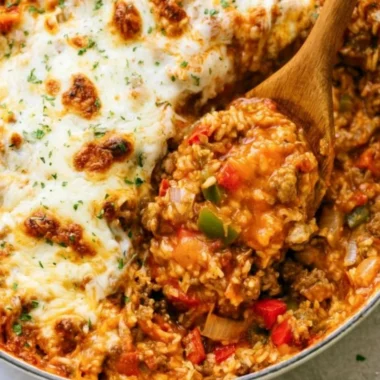 Delicious Stuffed Pepper Casserole in a baking dish above a colorful table setting.