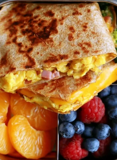 Delicious breakfast quesadilla filled with cheese, eggs, and vegetables