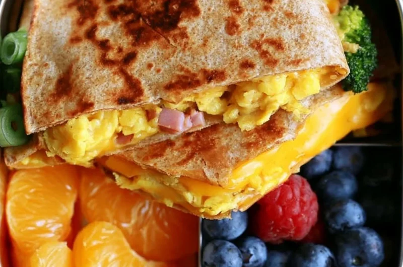 Delicious breakfast quesadilla filled with cheese, eggs, and vegetables