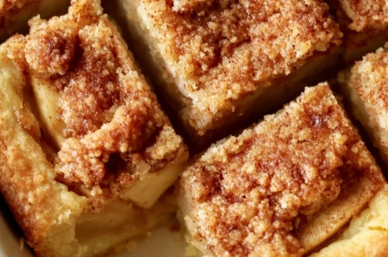 Cozy apple pie bars with fresh apples and cinnamon on a rustic wooden table