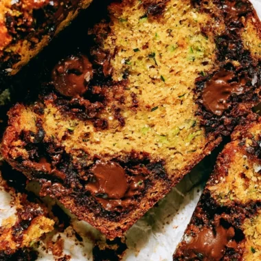 Delicious slice of cozy chocolate chip zucchini bread fresh out of the oven.
