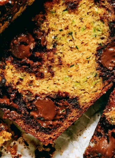 Delicious slice of cozy chocolate chip zucchini bread fresh out of the oven.