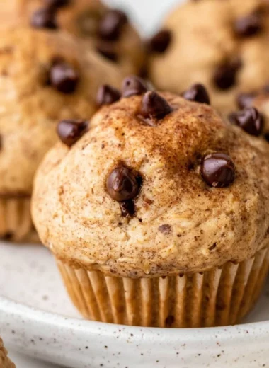 Cozy cottage cheese muffins with chocolate chips on a wooden table
