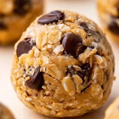 Delicious and nutritious cozy oatmeal protein balls on a wooden plate.
