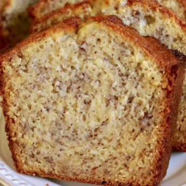 Delicious slice of cozy banana bread with a golden crust and ripe bananas