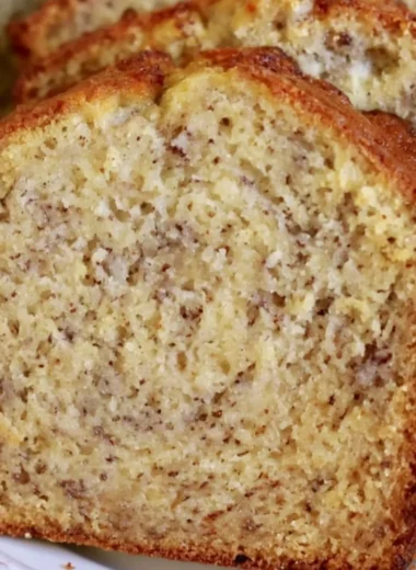 Delicious slice of cozy banana bread with a golden crust and ripe bananas