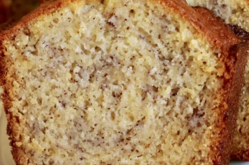 Delicious slice of cozy banana bread with a golden crust and ripe bananas