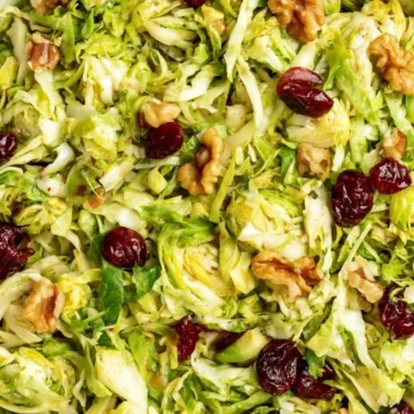 Cozy shaved Brussels sprouts salad with vibrant toppings and dressing
