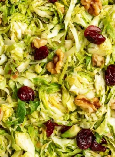 Cozy shaved Brussels sprouts salad with vibrant toppings and dressing