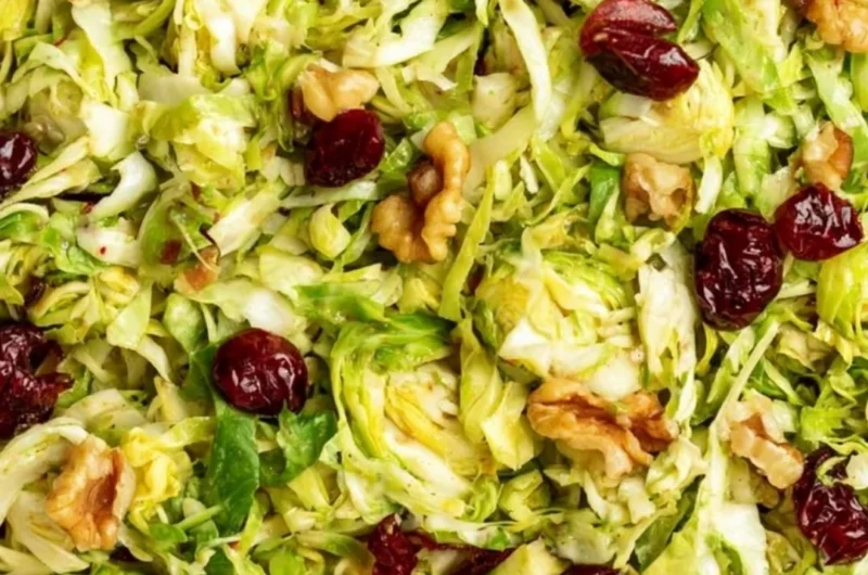 Cozy shaved Brussels sprouts salad with vibrant toppings and dressing