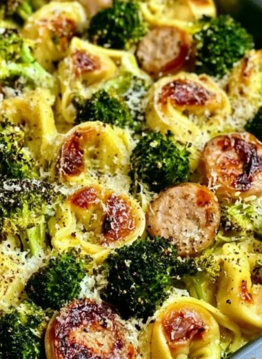 Sheet pan broccoli tortellini bake with melted cheese and fresh vegetables