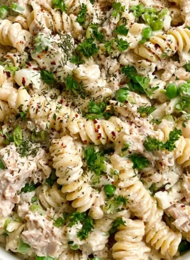 Bowl of easy tuna pasta salad with vegetables and dressing