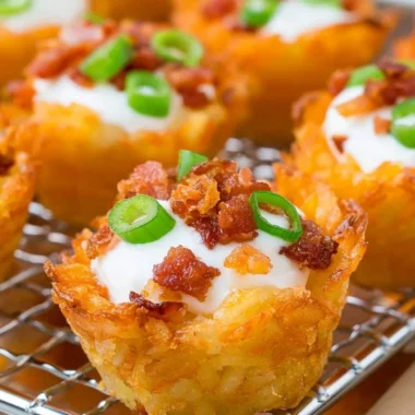 Delicious Loaded Tater Tots topped with cheese, bacon, and green onions.