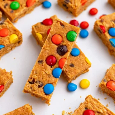 No-bake monster cookie protein bars with oats, chocolate, and peanut butter.