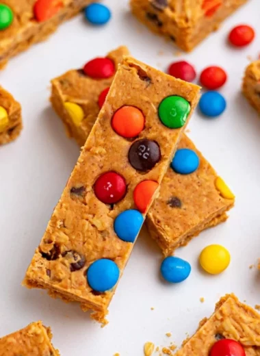 No-bake monster cookie protein bars with oats, chocolate, and peanut butter.