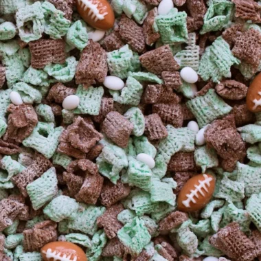 Bowl of Ultimate Football Puppy Chow with colorful snacks and treats
