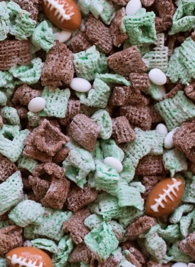 Bowl of Ultimate Football Puppy Chow with colorful snacks and treats