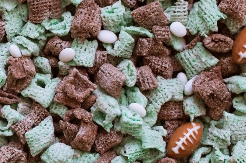 Bowl of Ultimate Football Puppy Chow with colorful snacks and treats