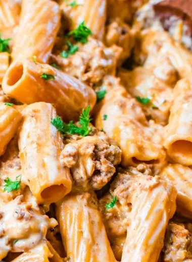 Cozy homemade cheeseburger pasta served in a bowl with fresh herbs