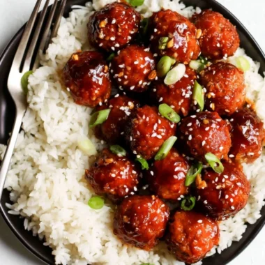 Delicious honey garlic meatballs served with sauce in a bowl.