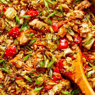 Colorful cabbage stir fry with fresh vegetables cooked in a skillet
