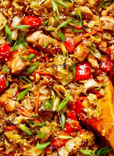 Colorful cabbage stir fry with fresh vegetables cooked in a skillet