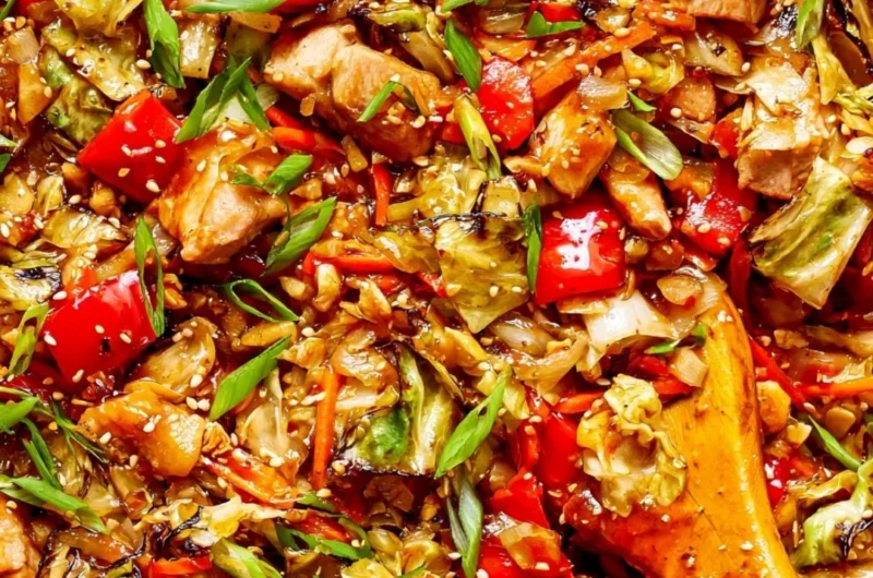 Colorful cabbage stir fry with fresh vegetables cooked in a skillet