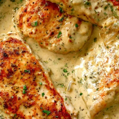Creamy ranch chicken dish served with herbs and spices.