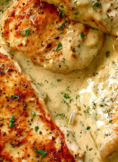 Creamy ranch chicken dish served with herbs and spices.