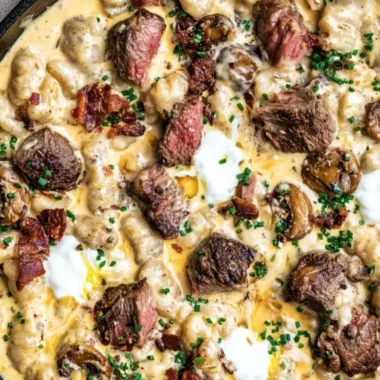Loaded steak and gnocchi skillet meal served in a pan